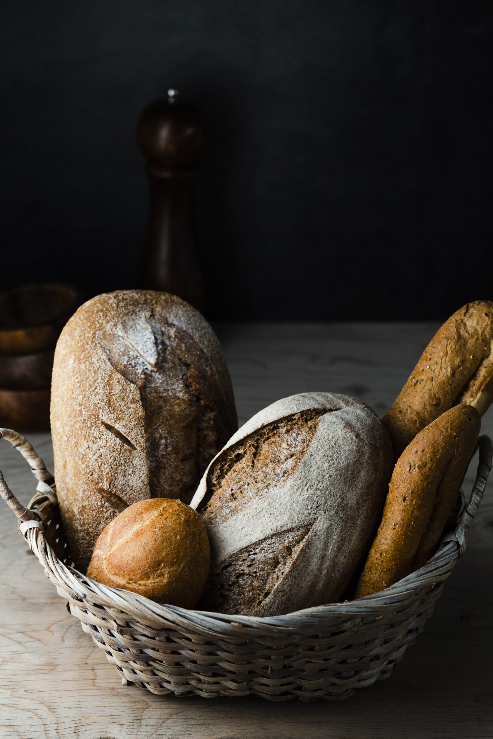 high-angle-bread-basket-wooden-table (1)