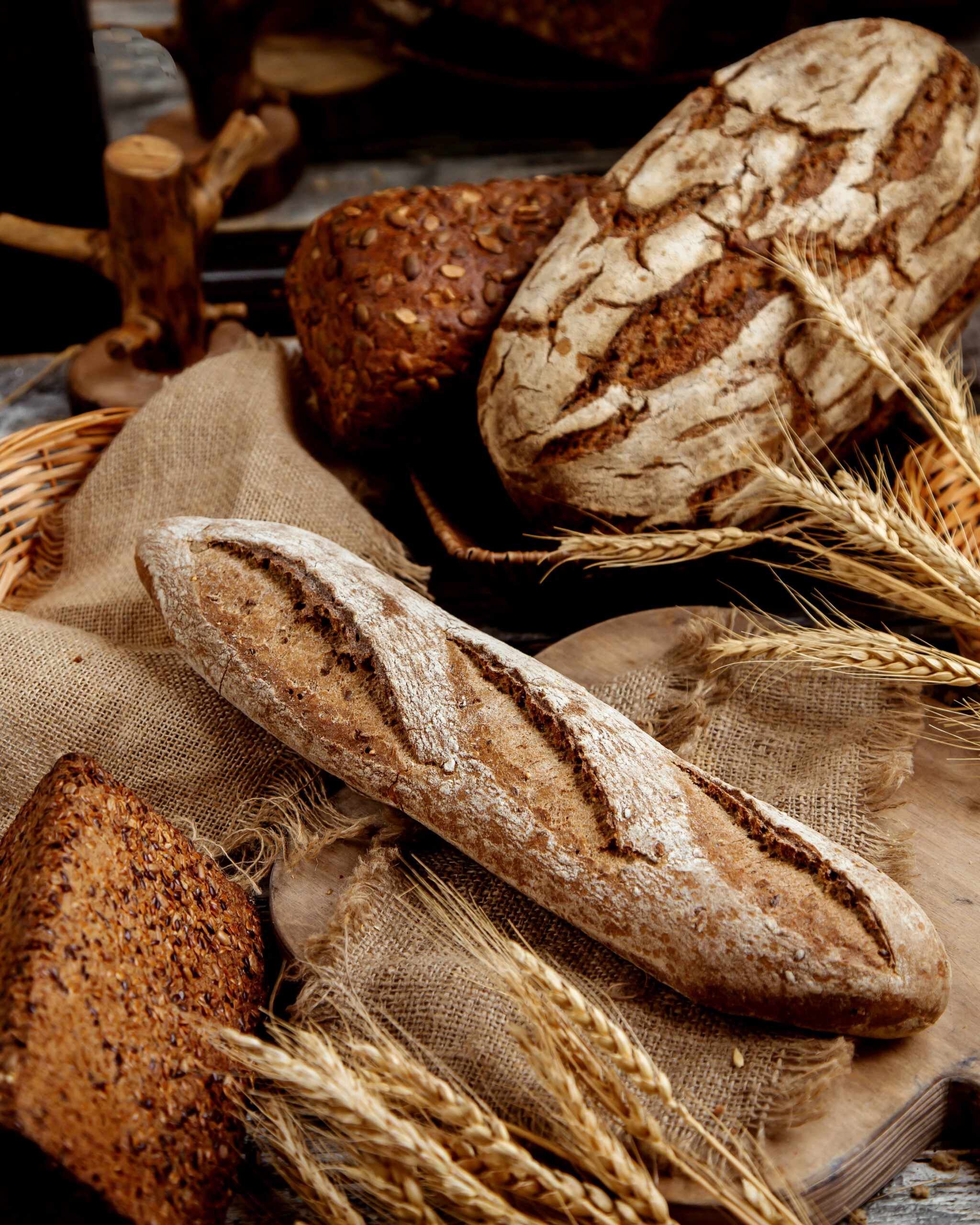 organic whole grain baguette placed on linen fabric