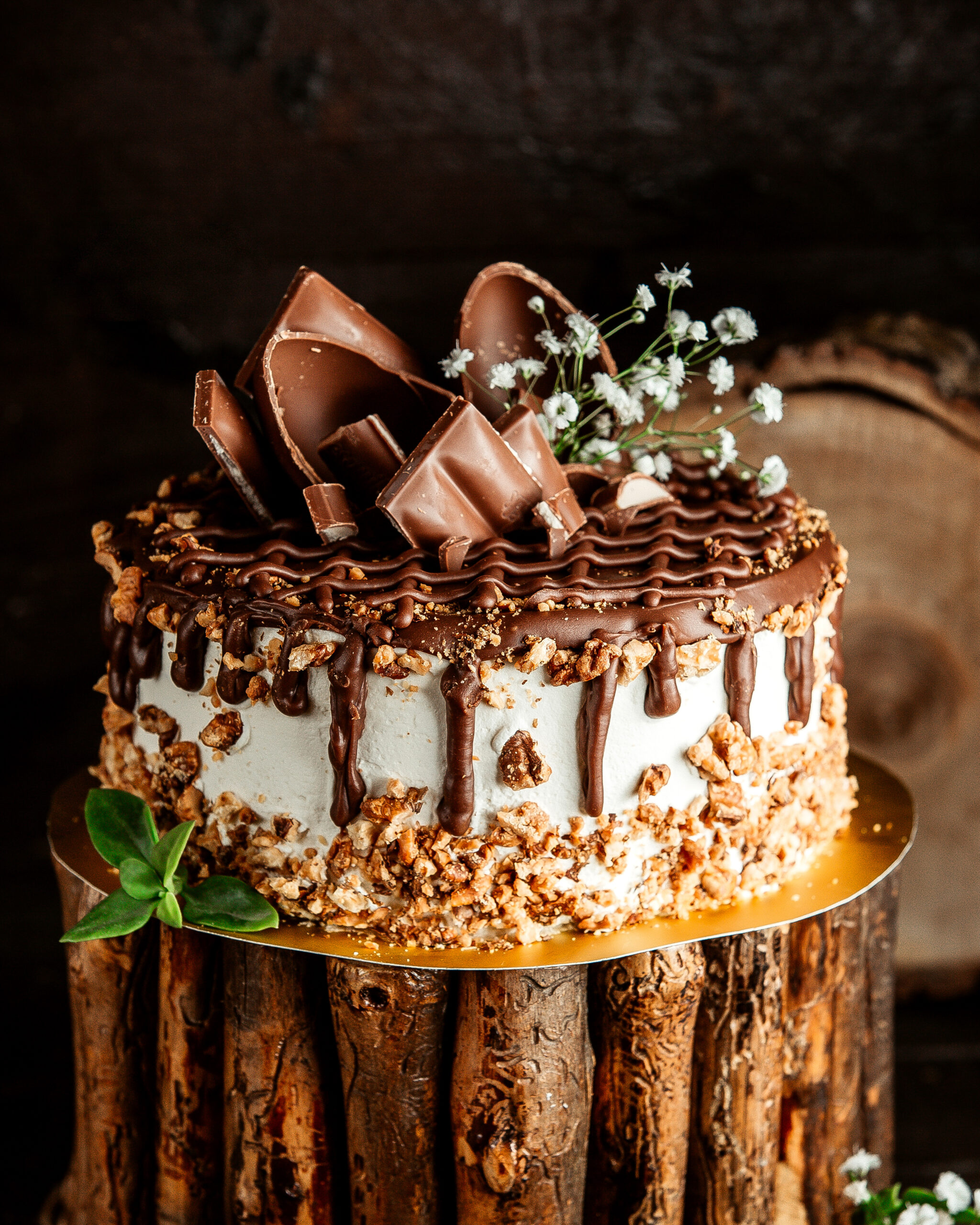 side view chocolate cake with cream nuts and chocolate spread